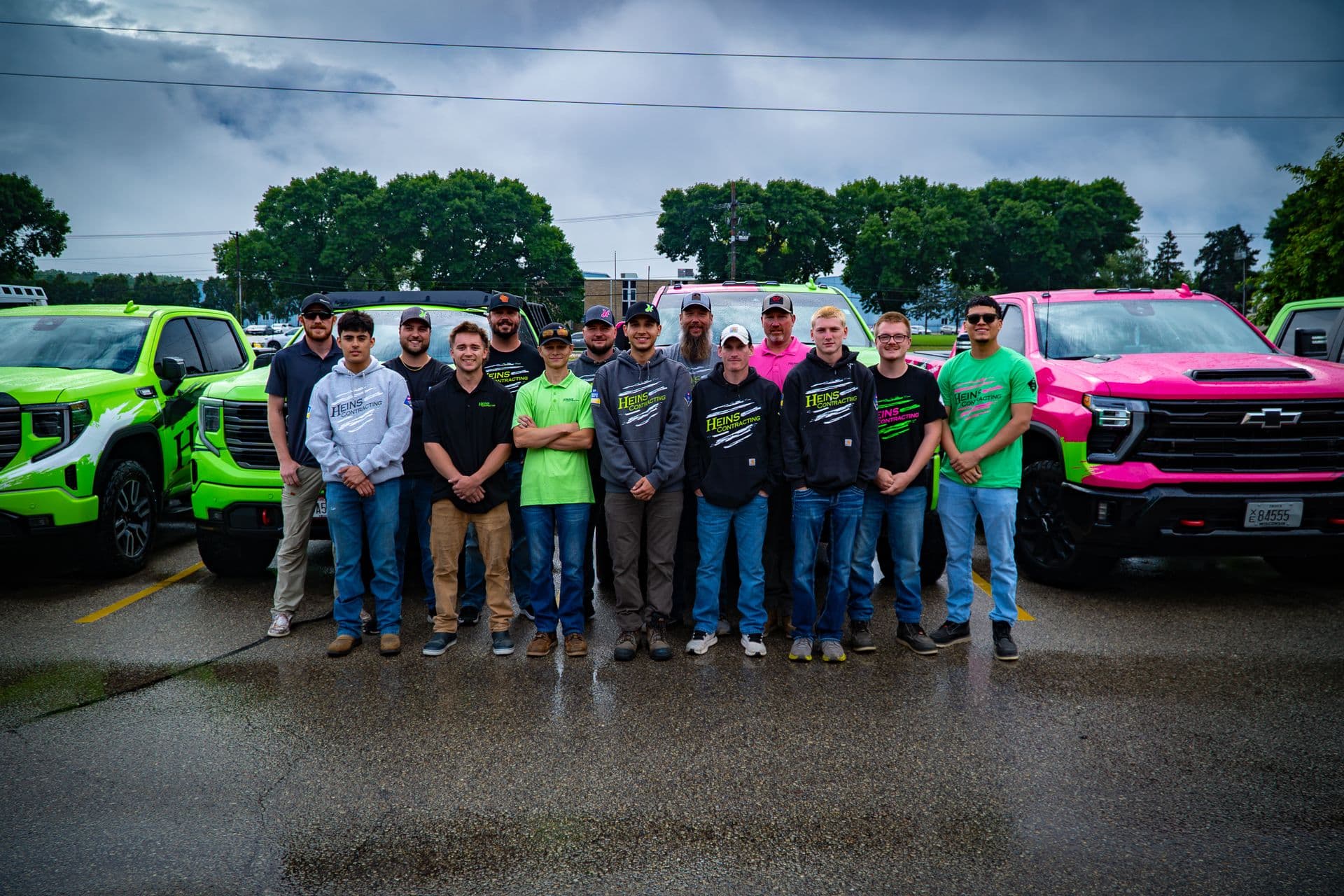 Project Managers In Front Of Trucks