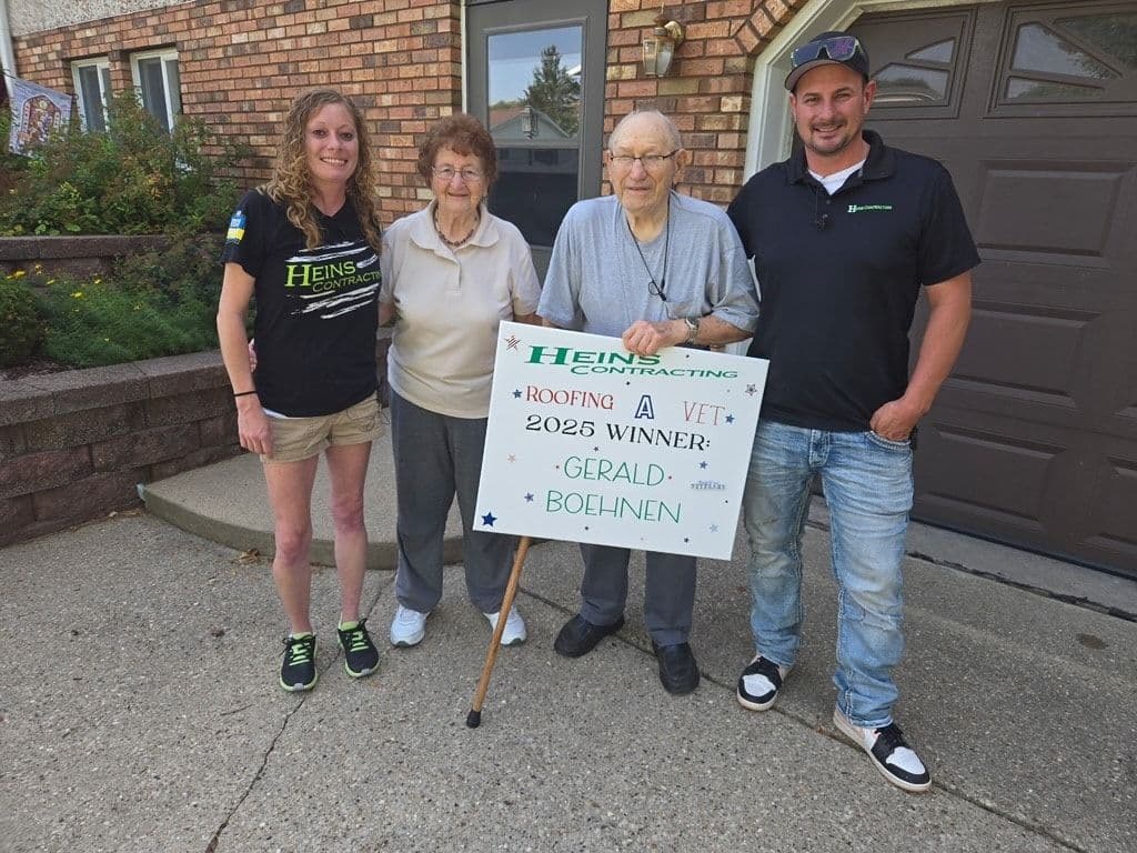 Heins Contracting employees with the winner of the 2025 Roofing a Vet giveaway.