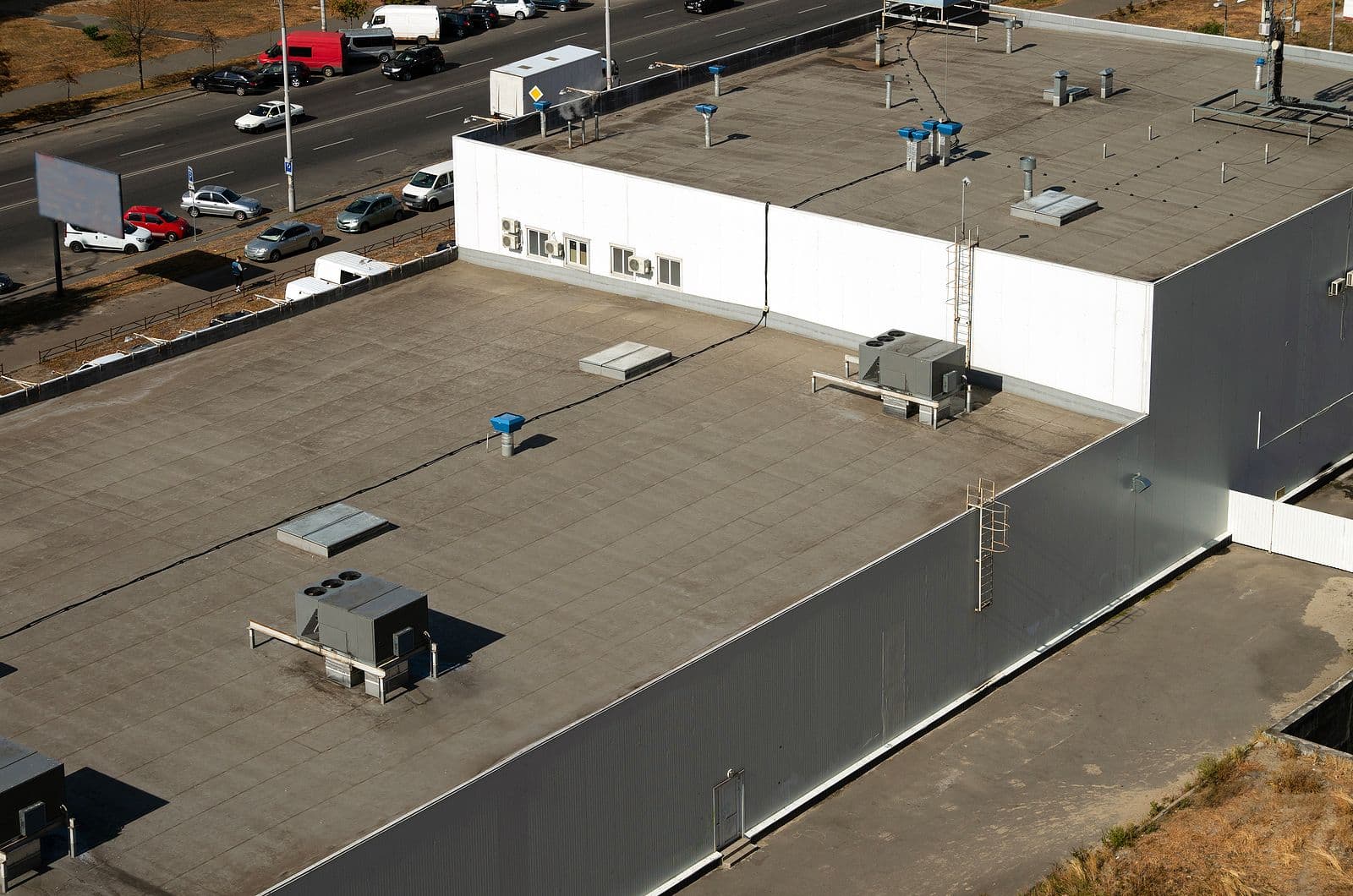 An aerial view of a flat roof on a commercial building.