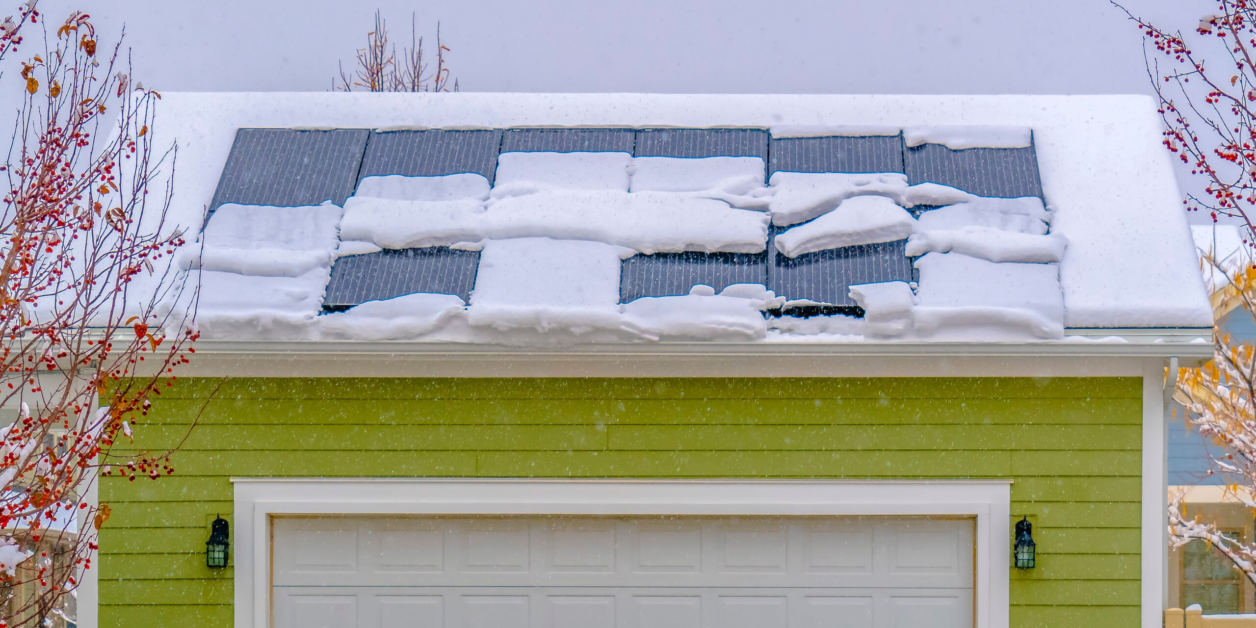 Solar panels on snow covered roof in winter